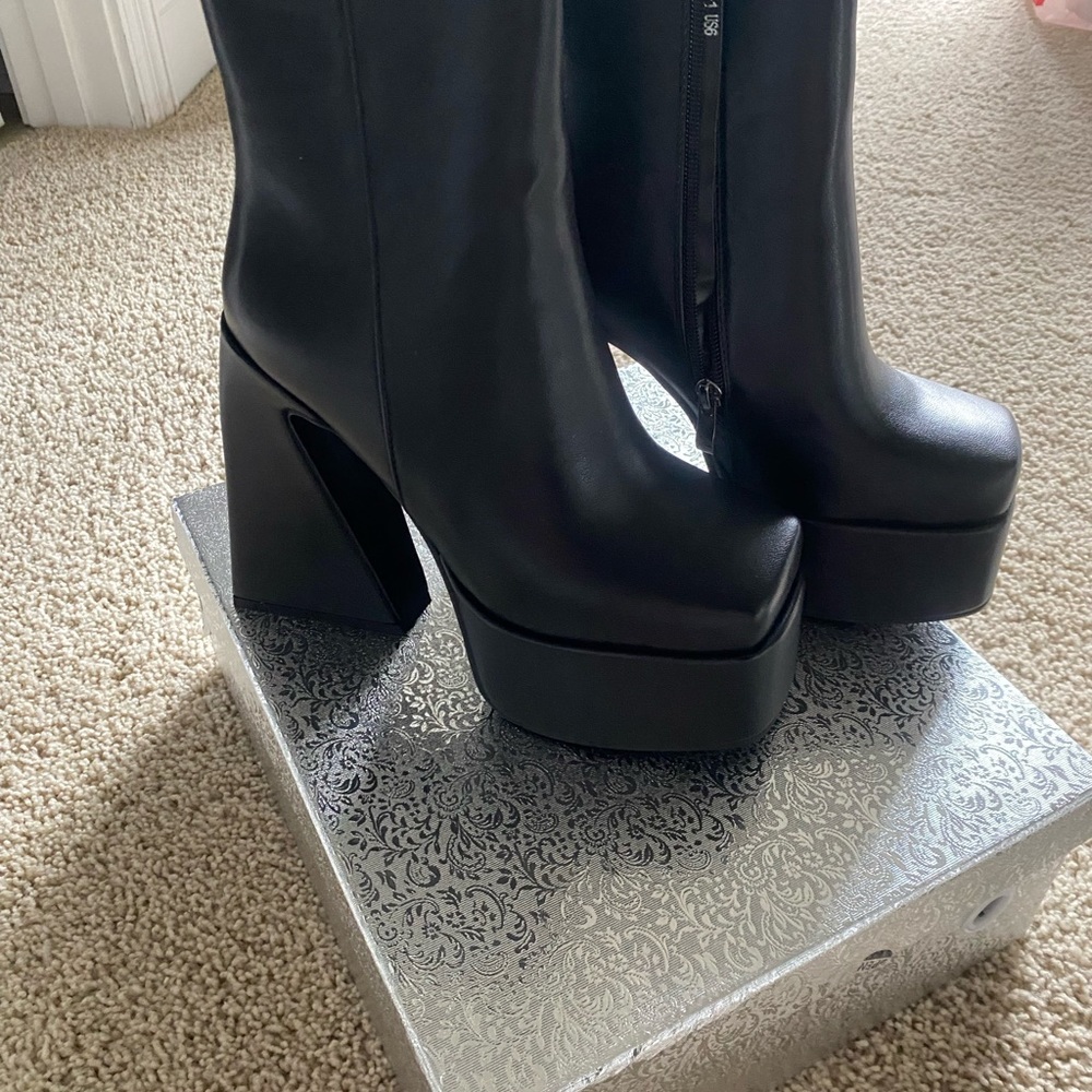 Black bootie. Platform appx 3 inch heel. Worn only once